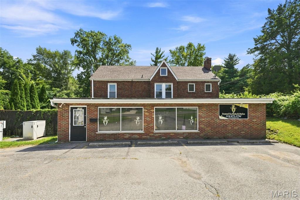 Entrepreneurs, Commercial Business Owners, and the general public, let's talk about working from home and running a salon suite business. #2 South Dellwood Ave / 1400 Chambers Rd. 63135.  Don't sleep on this diamond in the rough. This home has been carefully prepared for you and has not been on the market for over 17 years. This mixed-use property is a very rare and phenomenal opportunity. All-brick 2-bedroom, 1 bath, full basement with a recreational room, corner lot, and a commercial space with a half bathroom. The home features generous living and dining areas with a wood-burning fireplace and stunning hardwood floors. Great for entertaining.   This area flows into a beautiful kitchen with solid-surface countertops and an ample amount of cabinets. All appliances and washer /dryer will stay in its as/is condition.  The entire home has been freshly painted in 7/2026. Some updates to plumbing in 3/2026; new carpet on lower level installed 7/2026. Very well-maintained home.
The commercial space alone is an excellent mixed-use investment opportunity! It was being used as a barbershop with 6 individual booths;3 other separate private rooms; and 10 parking spaces. Could also be a dental office, dog groomer, office space, beauty shop, tattoo shop, nonprofit, educational institution, or community-focused enterprise. Unique multiplex/mixed-use building opportunity to walk into a turnkey asset with potential income. Live in the residential unit and work from the commercial side.