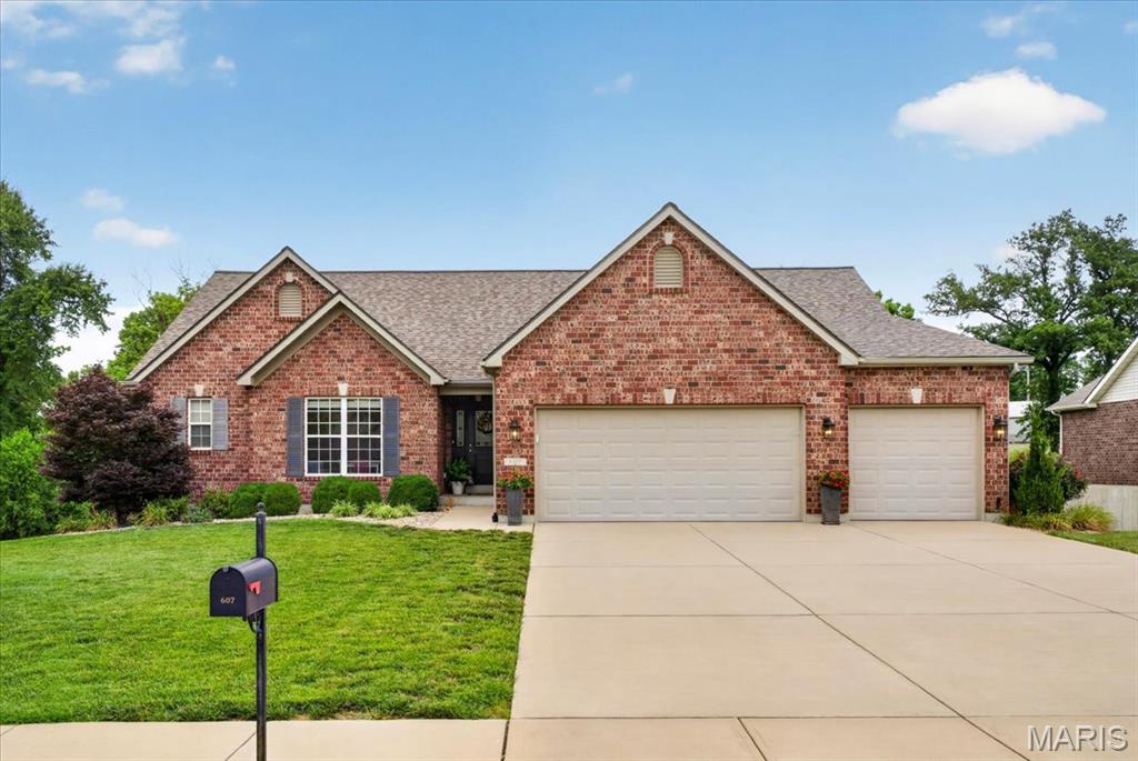 Ready to move in and make this home yours... beautiful split ranch home in The Village of Wernings subdivision on the North side of Columbia!  Beautiful curb appeal with lush landscaping and 3 sides of Brick, this home has it all.  Immediately fall in love with the open concept main living space that features soaring vaulted ceilings, great room with double windows flanking the direct vent gas fireplace and gleaming wood floors. Formal dining room or study right off the main living space.  The luxury kitchen package includes 42" upper kitchen cabinets, huge island with tons of seating and prep space, granite counter tops & stainless steel appliances and deck off the breakfast room. The primary bedroom offers a bay window, large walk in closet and on-suite featuring cultured marble tub & shower as well as adult height double bowl vanity. Finished walkout lower level with acid washed concrete floor has plenty of space for all of your friends and family with a huge rec room, living room with cozy fireplace, 4th bedroom, full bath, 3 storage areas and kitchenette right off the backyard of your dreams!  Make your way outside to find a amazing Salt Water pool featuring a tanning ledge and huge patio with enough space to grill, play games or just sit and enjoy the view.  Don't forget about the 3 car attached garage!  This home is just waiting for you!