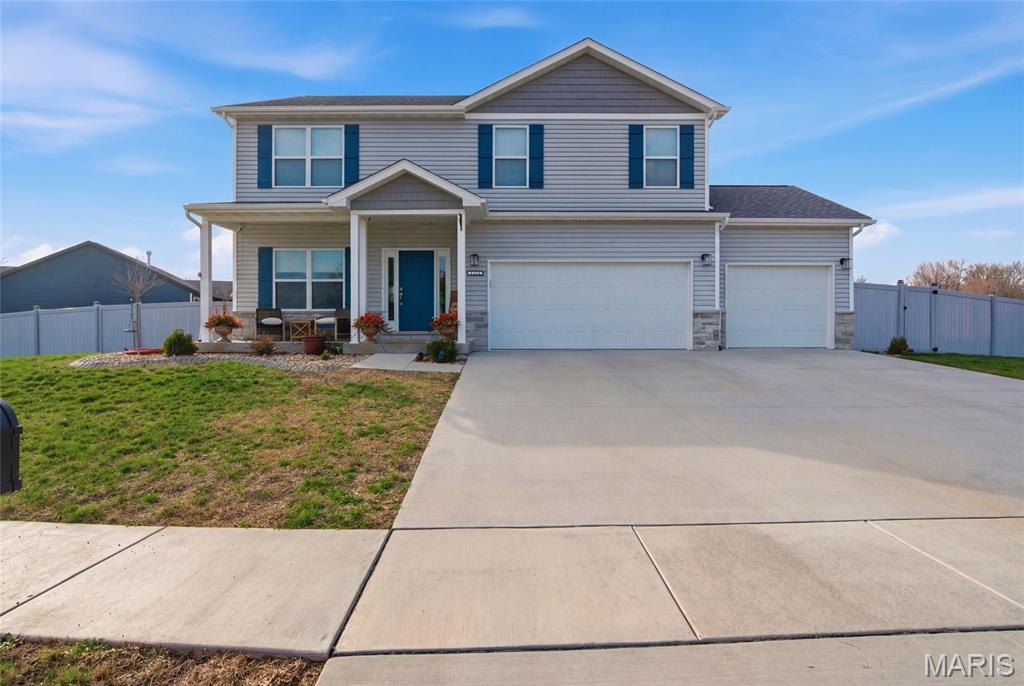 Absolutely stunning and still feels like new! Just two years old, this beautiful Mascoutah home combines modern style with a warm, welcoming layout—plus a fully fenced backyard and peaceful pond views that make coming home feel like a retreat.

Step inside to a light-filled, open floor plan designed for both everyday living and easy entertaining. The inviting living room flows seamlessly into the gourmet kitchen, where you’ll find a gorgeous island, granite countertops, stainless steel appliances, a large pantry, and plenty of space for gathering or creating your culinary favorites. Just off the main living area, the covered deck is the perfect spot to relax, grill, or simply enjoy the calming pond view.

The backyard is truly a standout feature—spacious, fully fenced, and ready for it all. Whether you’re envisioning games and recreation, gardening beds, weekend barbecues, or just enjoying a little extra privacy, there’s room here to make it your own.

Function meets style with a thoughtfully designed drop zone and a convenient pocket office, ideal for staying organized or working from home. The finished lower level adds even more flexibility with a large family room, an additional bedroom, and a full bath, making it perfect for guests, extended stays, or extra living space.

Upstairs, you’ll find three bedrooms, including an impressive primary suite that feels like a true retreat. The oversized bedroom easily accommodates large furniture and still feels open and airy, while the massive walk-in closet has been customized with built-in organization. The en suite bath is equally impressive, offering a spa-like feel and plenty of space to start and end your day in comfort.

With a 3-car garage, stylish finishes throughout, scenic pond views, and a yard that offers both privacy and endless possibilities, this home delivers the lifestyle you are looking for—without the wait of new construction. Don't let this be the one that got away, call your favorite agent for your private showing today!