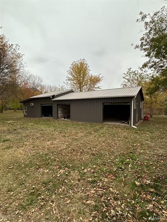 Have you been itching to stretch your legs with some more property? Peaceful living, while only being minutes away from the comforts of town? This is the home for you!! The perfect blend of rural living!! Welcome to your dream home!! Located on Old Route 66, your new 1800 sq foot, 3 bed, 1 bath home sitting on 7.22 acres with outbuildings is waiting for you!! Located just outside of Litchfield, this property offers the peace and serenity of country living without the long drive back into town or the interstate. Enjoy the seasons on your enclosed sunroom!! Walk into the elegance of a beautifully remodeled home! Large family room and living room combined! Dining room and Kitchen combined to give all the space needed for dinner or entertaining! A 1 car attached garage offers perfect parking out of the elements. True hardwood floors throughout the home!!! Two outbuildings in the backyard, perfect for storage, workshops, or endless possibilities! Enjoy your sprawling 7.22 Acres with the pond, creek, fruit trees, garden, walking trails, and boundless potential!! Call your favorite agent today to schedule a showing before it’s too late!!