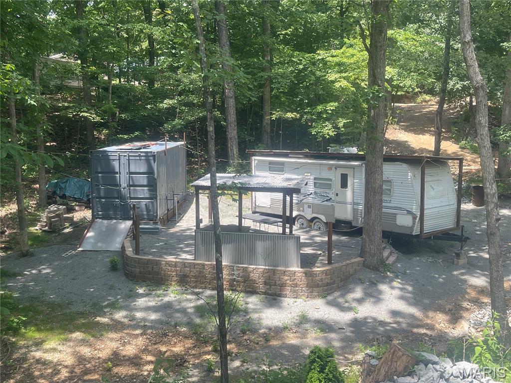Welcome to this well maintained property that comes with 2 lots ,a camper. and steel container.  It is all set up to start enjoying all that Goose Creek has to offer.  Everything you see on the property is included in the sale. The lot is located in close proximity to the beach, lake and community swimming pool. Goose Creek Lake is  approximately 400 acres and provides for a wide variety of  water sports, boating , fishing, swimming and much more. This is an amazing opportunity to start the summer off right.