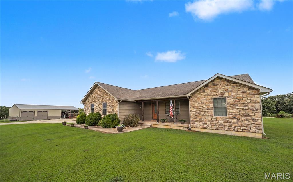18960 County Road 1000, St. James, MO 65559

Move-In Ready 3.9-Acre Hobby Farm with Shop, Perimeter Fencing & Split Floor Plan — Minutes from Town on All Paved Roads!

Welcome to your Ozarks retreat, ready and waiting! This beautifully maintained 3-bedroom, 2-bathroom home, built in 2015, offers 1,644 sq ft of thoughtfully designed living space with an open-concept living area and desirable split floor plan for privacy and everyday flow. The partially finished basement adds valuable bonus space for a rec room, home office, or extra storage — flex space to fit your lifestyle.

Set on 3.9 fully-fenced acres with perimeter fencing already in place, this property is truly hobby-farm ready — bring the animals, the garden, and the projects with zero setup required. A large shop with an open shed roof provides ample space for equipment, tools, livestock shelter, or a workshop, making this an ideal setup for hobbyists, small-scale farmers, or anyone craving extra storage and functional outbuildings.

Enjoy the best of both worlds: peaceful country living just minutes from St. James on all-paved roads, offering easy, convenient access to town, schools, shopping, and dining without sacrificing space or privacy.

Move-in ready, income-flexible, and full of possibility — this property checks every box for buyers seeking acreage, functionality, and convenience all in one place.

Don't miss this rare combination of home, land, and outbuildings — schedule your private showing today!