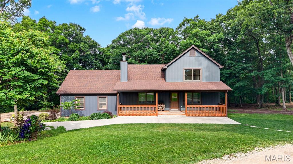 NEW BUYER INCENTIVE! The sellers are now offering a 1-1 Interest Rate Buy-down! This is a great opportunity to reduce your monthly payment during your first two years of homeownership.

The property still offers everything that made it special:
• Approximately 7 private acres
• Stocked pond, creek, wooded trails, and huntable acreage
• Custom home built from timber harvested on the property
• Large heated and cooled shop with car lift
• Low property taxes and no monthly public water or sewer bills.           

The layout features a main-level primary suite, two bedrooms upstairs, an additional bedroom in the walkout lower level, and three full bathrooms with one located on each level. The owners also added additional living space, adding even more room for entertaining and everyday living. Additional features include an attached 1-car garage and a private country setting that combines timeless rustic craftsmanship with modern functionality.

Outdoor enthusiasts and hobby farmers will love the property's unique amenities, including a 10x18 chicken coop with a similarly sized fenced run, offering endless possibilities for creating your own mini homestead. The combination of unrestricted wooded acreage, trails, wildlife, creek, pond, and open space makes this property a rare opportunity for recreation, relaxation, and country living. A standout feature is the impressive approximately 1,500 sq ft detached shop complete with a 16x50 lean-to, carlift, heating, cooling, and its own separate electrical panel — ideal for a workshop, hobby space, home business, equipment storage, or recreational use.