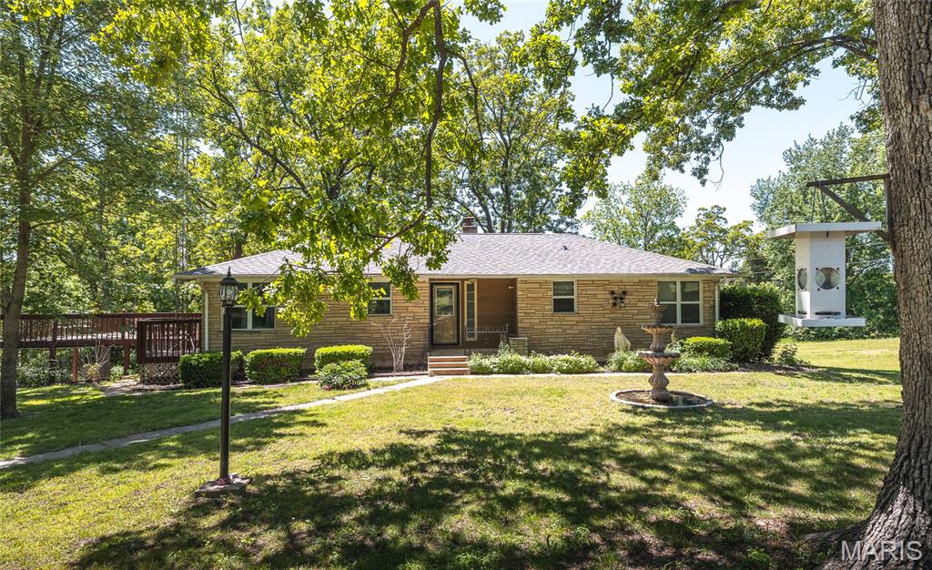 Discover peaceful country living just minutes from town in this beautifully updated ranch-style home on approx. 1.6 acres. Recent upgrades include a new electrical panel, well pump, newer A/C, fresh paint throughout, and stylish laminate flooring—plus elegant porcelain tile in the living room and kitchen. This warm and welcoming brick home offers 3 bedrooms and 1 full bath on the main level, with an additional bedroom and bathroom in the fully finished basement—perfect for guests, extended family, or extra living space. Step outside onto the expansive deck, ideal for morning coffee, evening sunsets, or weekend gatherings. From here, take in the view of the classic red horse barn and fenced area—ready for your horses or future farm animals. Nestled on a corner lot, the property offers a wonderful balance of privacy and convenience, giving you that country feel while keeping you close to everything you need. To top it off, the sellers are including a Home Warranty credit for added peace of mind. Move-in ready, thoughtfully updated, and full of charm—this is country living at its best.