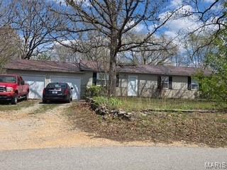 Take A Look at this Wonderful Ranch Style Home with 3 Bedrooms, and 1 Bath. With 1152 Sq Feet Of Living Area, and the Oversized 2 Car Garage, this home is perfect for somebody starting out, looking for investment property, or somebody ready to slow down. Electric Heat, and Central Air. Home has Metal Roof, and large yard with .54 of an acre. Located just 15 minutes from Main Gate of Fort Leonard Wood. Wooded Lot for lots of privacy. Just listed for $199,500.