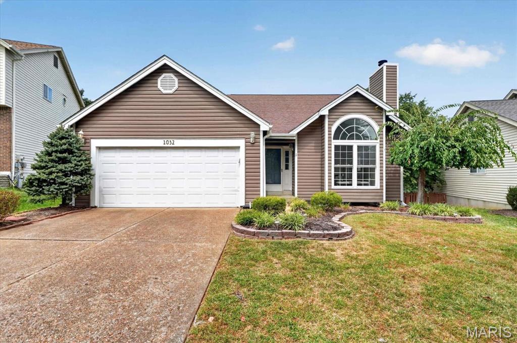 Welcome to this inviting 1.5-story home perfectly positioned on a level lot backing to a peaceful backdrop of mature trees. From the moment you enter, the vaulted foyer sets the tone, with hardwood flooring, a striking chandelier, and an open staircase leading to the upper level. The spacious great room is the heart of the home, featuring vaulted ceilings, a brick gas fireplace, bay window and an additional picture window, creating a bright and comfortable gathering space that flows naturally into the dining room. The kitchen offers granite countertops, laminate wood flooring, stainless steel appliances, built-in microwave, pantry and a convenient desk area with additional cabinetry and shelving. A bay window and French door provide a lovely connection to the deck and fenced backyard. The main-level primary suite offers a walk-in closet and private bath with double vanity, jetted tub, separate shower and linen storage. Fresh paint and new carpet throughout the main living areas add to the move-in-ready appeal. Upstairs, two additional bedrooms feature new paint and carpet, along with ceiling fans and access to a full bath. The finished walkout lower level expands the living space with a generous family/rec room, large closets, wet bar with cabinetry and sink, half bath, and direct access to the patio and backyard. Additional highlights include a main-level laundry room, updated flooring and paint, 2-Car garage, fenced backyard, large deck, and a wooded setting that offers privacy and a tranquil outdoor backdrop. With versatile living spaces and thoughtful updates throughout, this home offers the space, comfort, and flexibility you've been looking for.