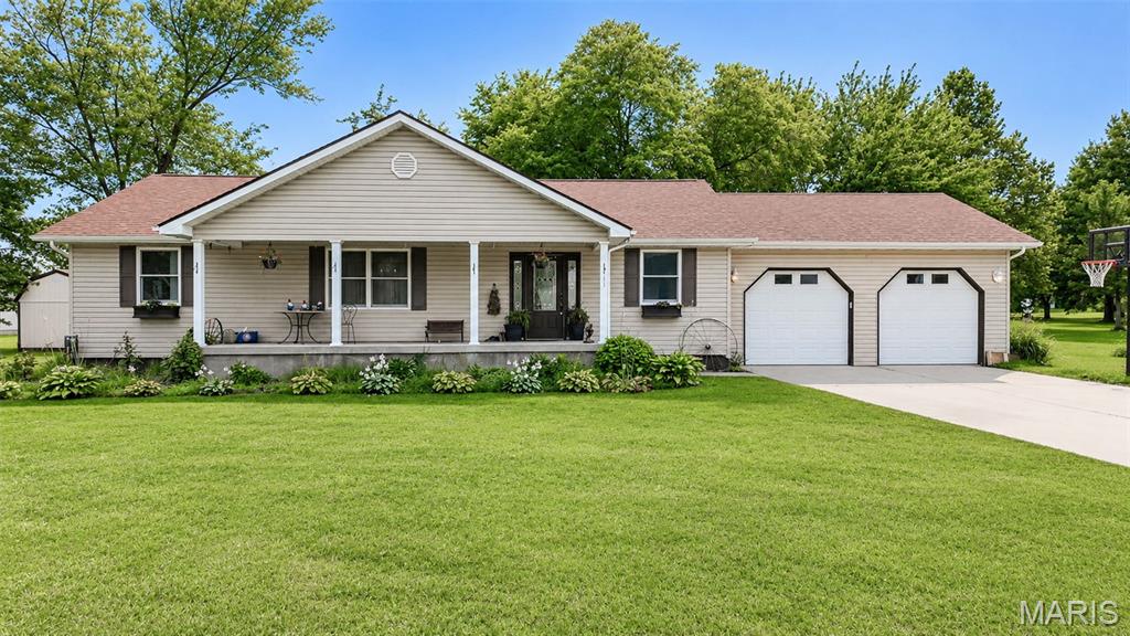 Welcome to this spacious **3-bedroom, 2-bath** home built in **2008**, offering the perfect combination of comfort, functionality, and room to grow. The open-concept floor plan features a large kitchen overlooking the dining and living areas, while **cathedral ceilings** create a bright and airy space that's perfect for both everyday living and entertaining.

The **full basement** provides exceptional versatility with a **17' x 13' finished room** already completed and ample unfinished space ready for additional bedrooms, a family room, game room, home office, exercise room, or extra storage. You'll also appreciate the convenience of **two washer and two dryer hookups**, making laundry day a breeze or providing flexibility for future living arrangements.

Step outside to enjoy the **covered front porch**, perfect for relaxing with your morning coffee, or unwind on the **back deck** overlooking the backyard. The **detached two-car garage** offers plenty of room for vehicles, storage, and projects, while the **sump pump** provides added peace of mind.

Whether you're looking for a move-in-ready home with a spacious layout or one that offers endless possibilities for future expansion, this property is ready to fit your lifestyle.