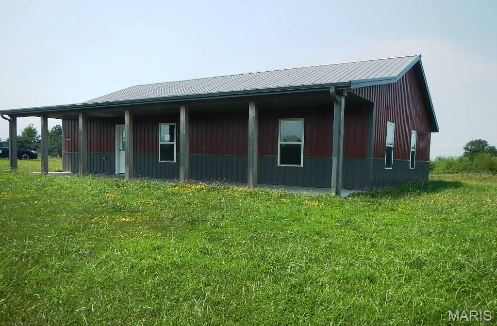 Spacious and open home with 3 bedrooms, 2 bathrooms is ready for a new owner! This open concept home is located on 5.3 acres in the close to the Mark Twain Lake area! This home is located between the Elk Fork and South Fork boat ramps on Hwy 154, just a few miles from many lake area amenities. This ranch style barn home features a full length covered front porch with a concrete patio at the back of the home, metal roof and siding. Special features include stainless appliances, butcher block counter tops, luxury vinyl plank flooring, open floor plan, vaulted ceilings and much more! Great lake location which is perfect for families, retirement, or get away weekends at Mark Twain Lake! Easy to show, set your appointment today!

If property was built prior to 1978, Lead Based Paint Potentially Exists. Buyer to verify schools, square footage and HOA information with an offer.