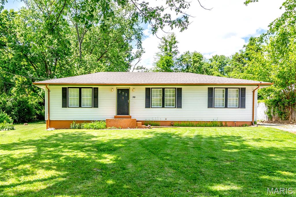 Come visit this ranch style property on a half acre lot in Melville, MO. Move in ready home that has been completely renovated. Hardwoods and vinyl plank throughout, new kitchen cabinets and appliances, and an updated full bath. Walk out on the back deck to view the serene landscape and the new gravel drive. Large back yard that will allow access for landscape equipment or storage of trailers and motor vehicles. No HOA. Freshly painted inside and out. Oakville high school district. Whether you are a first time home buyer or looking to downsize, this home will not disappoint.  Schedule you showing today!