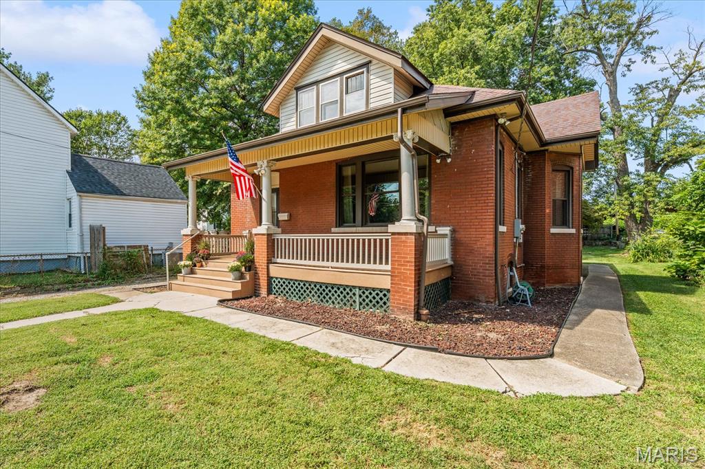 Welcome to 603 Sycamore Street, the classic brick bungalow you’ve been waiting for! This home has already passed Belleville occupancy and is ready for its new owner! Located just a few blocks from downtown and all of its dining, shopping, and entertaining, this  four-bedroom, two-bath home has plenty to offer.

As you arrive, you'll find an inviting front porch, a great place to sit and enjoy the neighborhood or gather with family and friends.

Step inside to the oversized living room with 9.5-foot ceilings, original hardwood floors, original woodwork, and a gas fireplace. A large front-facing window looks out over the porch and fills the room with natural light. You’ll also find a formal dining room, two bedrooms, and a full bathroom on the first floor, featuring a laundry chute, a charming nod to the era of the home. The primary bedroom and hallway have new carpet. The kitchen includes a walk-in pantry.

Upstairs, you’ll find two additional bedrooms, a full bathroom, and a bonus room that would make a great home office or study. You'll also find new LVP flooring and a new HVAC system dedicated to the second level, installed in 2026.

The full unfinished basement provides plenty of storage and workspace. The home is being sold as-is. Call your favorite agent today to schedule a showing!
