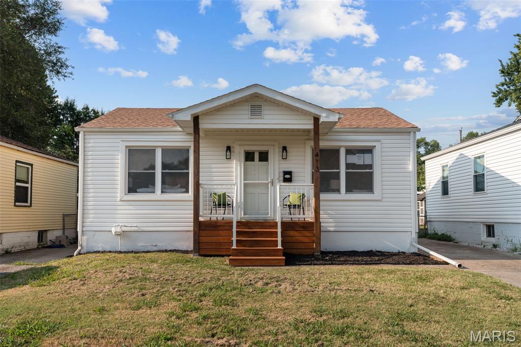 Fully renovated 1948 bungalow three minutes from Historic Main Street St. Charles. Hardwood floors, a brand-new kitchen, a brand-new bath, and a price that leaves room in the budget.

The living room welcomes you with original hardwoods, a wood slat accent wall and a ceiling fan. The kitchen is all new: white shaker cabinets, stone countertops, sage green tile backsplash, brushed gold faucet and hardware, and a full stainless appliance package that stays. Two bedrooms, both with hardwoods and ceiling fans. The full bath is all new too: tiled tub surround, new vanity, matte black fixtures and new lighting. Fresh paint throughout. Updated plumbing and electrical.

Outside: a covered front porch with new stairs and railings, fresh landscaping, low-maintenance vinyl siding and an architectural shingle roof. The long driveway leads to a detached garage and a fully fenced, level back yard. The full unfinished basement has French drains and sump pump. Cinder block foundation walls are reinforced throughout with vertical steel beams.  Dry storage today, workshop or finished space tomorrow.

Central air, gas forced-air heat, city water and sewer. One-level living on a quiet street near Blanchette Park, Lindenwood University and Frontier Park on the riverfront. FHA, VA, conventional and cash all welcome. Move-in ready. Just bring your furniture.