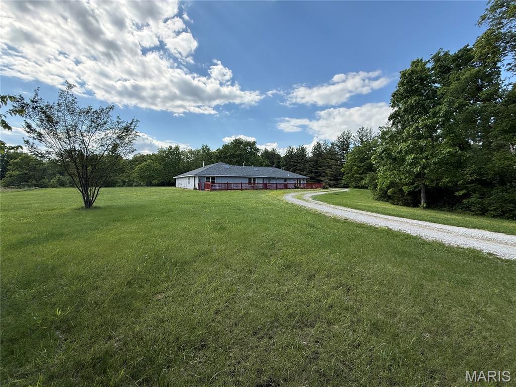 Private 17.2 +/- Acre Country Setting with Unique Multi-Generational Layout
Tucked back off the road behind the trees, this 3,176 +/- sq. ft. home offers a peaceful setting on 17.2 +/- acres in the Waterloo School District. Built in 1988, this unique slab home was thoughtfully designed with flexibility in mind—almost like two living spaces under one roof.
The main side features a full kitchen, dining area with wet bar, large living room, full bath, primary bedroom, and an attached 2-car garage. The additional suite-style side includes a small kitchen area, utility space, 3 bedrooms, and a large finished room that houses the indoor pool—ideal for extended family, guests, hobbies, or additional living space.
The home offers tile flooring, plenty of natural light, and a shingled roof replaced in 2024. Outside, enjoy a private mix of tillable and wooded acreage, along with a 2018 swim pool inside for exercise throughout that year. 
Located at 4157 Wetzler Rd, Fults, IL, with approximate drive times of 45 minutes to Belleville, 53 minutes to St. Louis, and 1 hour to Scott Air Force Base.