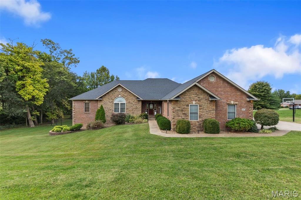 This gorgeous home in the Kelso C-7 (New Hamburg) School District truly has it all - space, style and updates in every direction! Built in 2008 and set on nearly an acre with a private, fenced backyard, this stunning 4-bedroom, 3 full and 2 half bath home offers over 5,600 sq. ft. of living space across two levels.

The main floor features 2,825 sq. ft. with three bedrooms, two full baths and a half bath. A see-through fireplace connects the living and dining spaces, adding warmth and charm. The living room remodel (2017) and kitchen renovation (2021) bring a modern touch with quartz countertops, dual ovens/ranges and stylish finishes. The laundry room was also updated in 2021 for added function and style.

Downstairs, enjoy a fully finished basement (2,014 finished sq. ft. of the total 2,825) complete with a wet bar, stovetop and gas fireplace, perfect for entertaining or relaxing. The lower level also includes a bedroom, full bath and half bath, plus walkout access to the patio and backyard.

Additional highlights include:
Geothermal HVAC system (new in 2023)
New roof (2019)
New water heater (2022)
New deck flooring (2025) overlooking the spacious yard
Three-car garage plus John Deere room/garage
Private driveway and security camera system

Appliances and fixtures included: ranges/ovens, microwave, water heater, water softener, garbage disposal, select mounted TVs (kitchen and main level bedrooms), light fixtures, ceiling fans and security cameras.

This property blends beautiful updates with classic comfort, offering room for everyone - indoors and out - in a peaceful, private setting.

Contact me today to schedule a private showing!