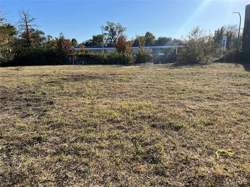 Large ,  leveled,  vacant lot in North St. Louis City!  100 ft x 125 ft (LOTS 3-6), this property offers endless possibilities for development.
Key Features:
 • Commercial Zoning: Perfect for a business or mixed-use project.
 • Build Potential: Room for three city houses or more—ideal for residential or multi-unit developments.
 • Convenient Location: Across the street from a Mobil gas station, ensuring visibility and accessibility.
 • Fully Fenced: Secured with two gate entrances for easy access.
 There are two entrances: Cora st and back alley.