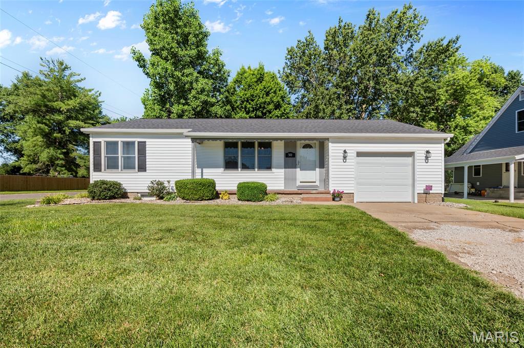 Welcome to this charming and meticulously maintained 3-bedroom, 1-bath home located in the heart of St. Jacob! Situated on a desirable corner lot, this home offers comfort, convenience, and plenty of space both inside and out. Step inside to find a bright and inviting layout featuring a spacious living room, a large kitchen with abundant cabinetry, a center island, and plenty of room to gather. The kitchen opens nicely to the family room, making entertaining easy and enjoyable. A separate dining area provides additional space for meals and gatherings. The family room is a standout feature with its generous size and cozy gas fireplace, creating the perfect spot to relax. The home offers three bedrooms with large closets in all the bedrooms. The main floor laundry room adds convenience and includes a separate shower. The washer and dryer are staying with the home. Outside, enjoy the corner lot, with a nice deck with pergola,  perfect for outdoor entertaining. The home also features an oversized one-car garage for extra storage and workspace. The basement provides endless possibilities and has been professionally waterproofed with a lifetime warranty. Recent updates include a new roof (Sept 2025), furnace (Mar 2026) & sump pump (Mar 2025). Enjoy being within walking distance to the elementary school and St. Jacob Park — perfect those who love a small-town community feel. A wonderful opportunity to own a move-in ready home in a great St. Jacob location! Call your favorite agent to tour today! 



Agent related.