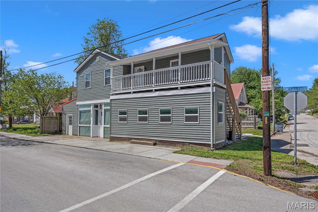 Renovated and income-producing, this well-maintained property in Hermann offers a fantastic investment opportunity. Featuring two long-term rental units, this property is already generating steady income with both units occupied under one-year leases. The lower unit has been beautifully updated and offers 4 spacious bedrooms and 3 full bathrooms, combining modern finishes with comfortable living space. The upper unit features 3 bedrooms and 2 bathrooms, providing a bright and inviting layout that tenants love. Situated in a desirable residential area, the property is conveniently located near local parks and schools, making it attractive for long-term renters. Enjoy the benefits of a walkable neighborhood in one of Missouri’s most popular and charming towns. Whether you’re expanding your portfolio or looking for a turnkey investment, this property offers immediate income and strong rental appeal in a sought-after location.