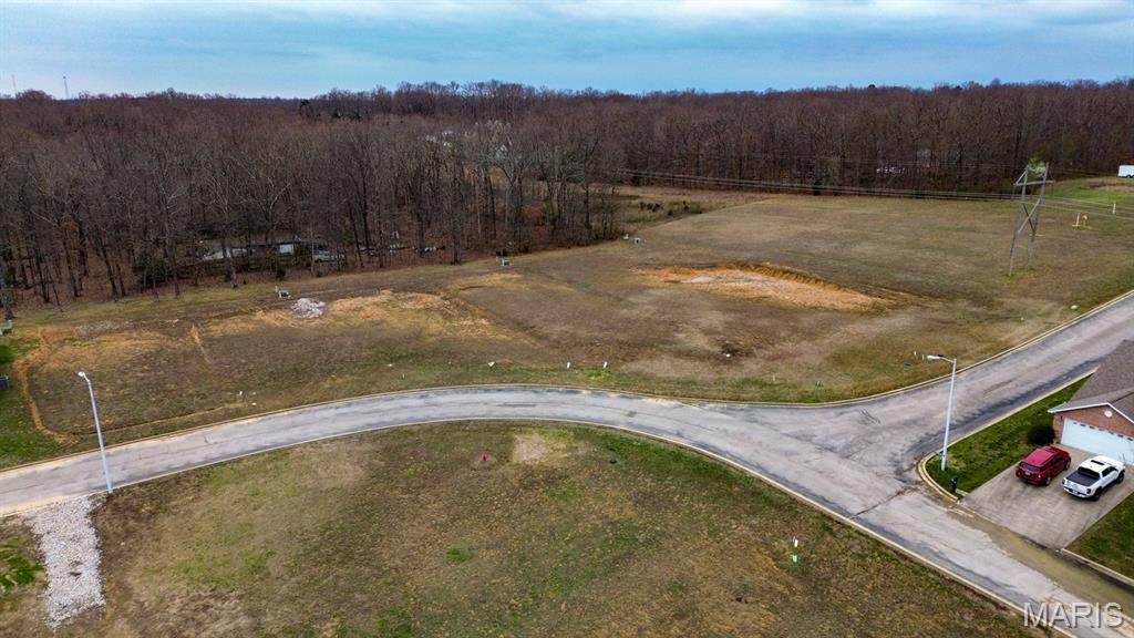 An exceptional opportunity awaits in the sought-after Mallard Pointe Subdivision just outside the Poplar Bluff city limits. This package includes six adjoining, level lots, all surveyed and graded for immediate construction. Whether you’re a builder looking for multiple home sites or a buyer seeking a larger parcel in a growing community, these lots offer outstanding potential. Located near shopping, medical facilities, and local amenities, Mallard Pointe combines convenience with the comfort of a well-planned neighborhood. As part of the Planned Urban Development HOA, residents enjoy lawn care, trash service, seasonal and road maintenance, and private lake access. Utilities including public water, sewer, electric, and fiber optic internet are stubbed up and ready to connect. With several new construction homes already completed in the subdivision, this is an ideal investment in a thriving, well-maintained community. Bring your vision—these six lots are ready for your next project!