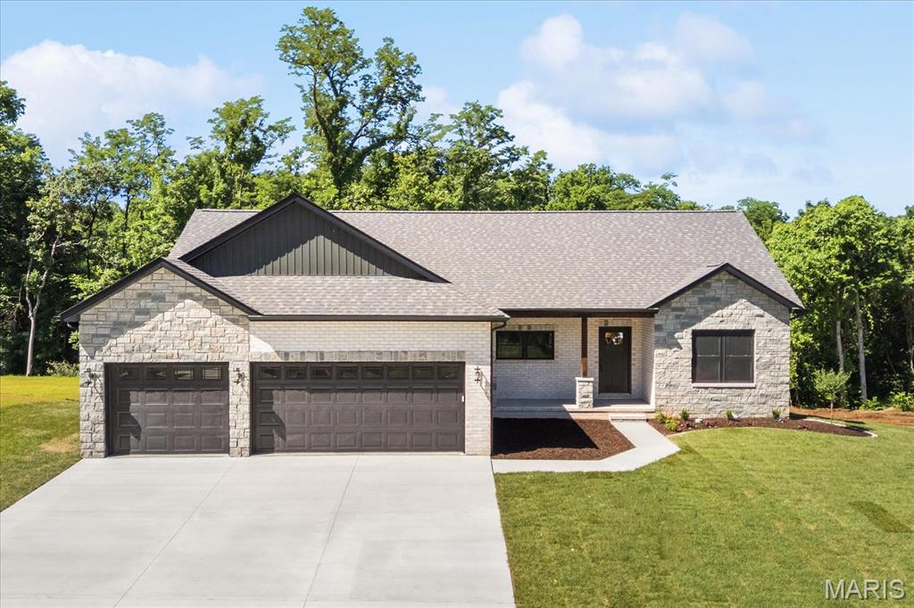 UNDER CONSTRUCTION.  Introducing the Aspen on beautiful Elbow Hill Ct! This extraordinary ranch offers 5 bedrooms, 3 baths, and 2,707 sq. ft. of finished living space. Built by Juliet Alpha Properties, quickly becoming one of the area’s premier builders with a growing reputation for quality and detail, this home showcases their signature style—distinctive window casings, designer shelving, durable luxury vinyl plank flooring, and a mix of abundant LED and smart motion-activated lighting throughout.  Situated on a .27-acre lot, the setting is hard to beat—wooded privacy behind the home and unbuildable wooded lots across the street create a peaceful, natural backdrop. Inside, the open floor plan features soaring vaulted ceilings in the great room, dining area, and primary bedroom.  The kitchen includes 42” soft-close cabinets, a large island, quartz countertops, under-cabinet lighting, and a full appliance package. Retreat to the primary suite with a gorgeous free-standing tub, dual vanity sinks, and a separate cultured marble shower. The finished lower level adds even more living space with a large rec room, two additional bedrooms, and a full bath.  Lifetime waterproof warranty, Energy Star construction, and so much more. Nestled in scenic Tanglewood with nature paths, stocked ponds, a playground, and miles of sidewalks for walkers and joggers—all just 20 minutes from St. Louis and Scott AFB. Visit TanglewoodIL.com for details.  Estimated completion date is Spring 2026.