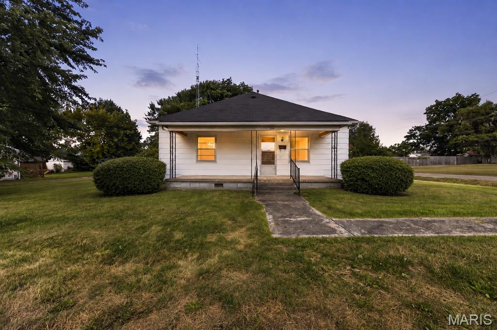 Offered for the first time on the MLS! This 2-bedroom, 1-bath home is ready for its next chapter. Situated on a level corner lot within walking distance to Bowling Green’s historic Town Square, the home features a spacious living room, dining room, kitchen, laundry room, walk-in pantry, covered front porch, and a 24’ x 30’ detached two-car garage/shop. City water and sewer. Being sold As-Is, this home needs some updating but offers plenty of potential for its next owner. Seller has never occupied home, no sellers disclosure available. Pictures have been virtually staged to illustrate the property's potential & help buyers visualize the space.