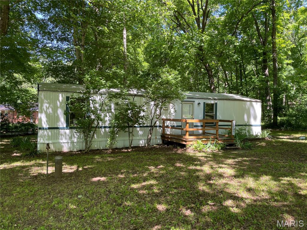 Completely remodeled and move in ready! Cute and comfortable mobile home sitting on a level, wooded, corner lot. Open floor plan, living room, kitchen and dining room, split floor plan, 2 bedrooms and one bath.  Front and back decks for entertaining or just sitting and relaxing. Nice starter home or weekend getaway. Black River Retreat gives you access to community boat launch and swimming.