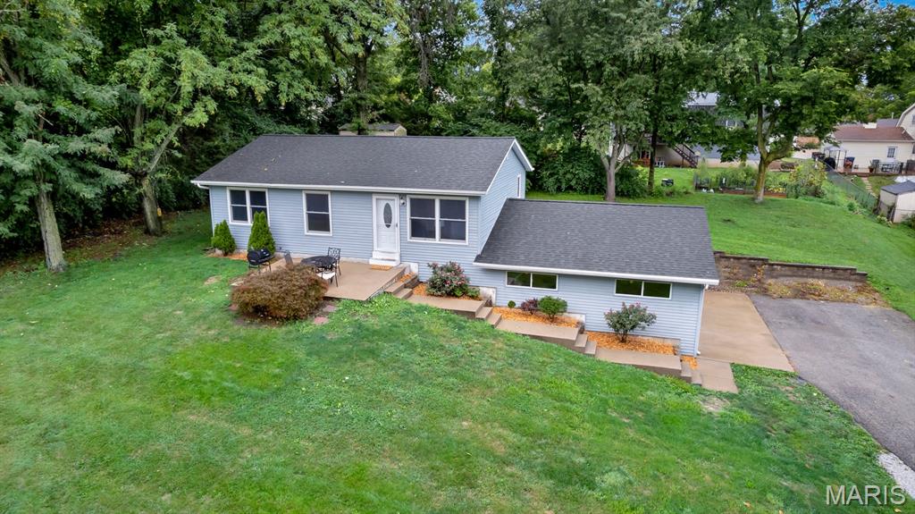 **$15k+ price reduction!** If you've been looking for a little more space and privacy without giving up the conveniences of St. Peters, 324 Westminster Drive is definitely worth a look. Sitting on nearly 3/4 of an acre, the property is set well back from the road with mature trees surrounding much of the perimeter, creating a setting that's surprisingly secluded for such a central location. The long driveway, oversized side-entry garage and generous amount of parking make the property feel more like you're arriving at a home in the country than one that's just minutes from Mid Rivers Mall Drive.

Inside, the main level has seen extensive updates over the past five years. Luxury vinyl plank flooring runs throughout much of the home, the interior has been freshly painted, and many of the big ticket items have already been taken care of, including Renewal by Andersen windows, a new roof, HVAC system, and more. The kitchen has also been updated with newer cabinetry and all appliances are less than five years old, making it a space that's ready to enjoy from day one.

The home's 1,434 square feet on the main level offers a comfortable layout with three bedrooms, including a primary bedroom with a walk-in closet. The lower level adds flexibility with additional finished space that's perfect for a rec room, hobby area, home office or workout space, along with plenty of unfinished storage, laundry room, and direct access to the garage.

Step outside and the lot really begins to shine. Whether you want room for kids and dogs to run, a large garden, future outdoor entertaining space or simply a yard that doesn't feel like you're living on top of your neighbors, you'll have the space to do it here. The insulated outbuilding provides even more options for storage, a workshop or hobbies.

Homes with this combination of updates, usable land and convenient location really don't come along very often, so schedule a showing soon so you don't miss out on this truly rare opportunity!
