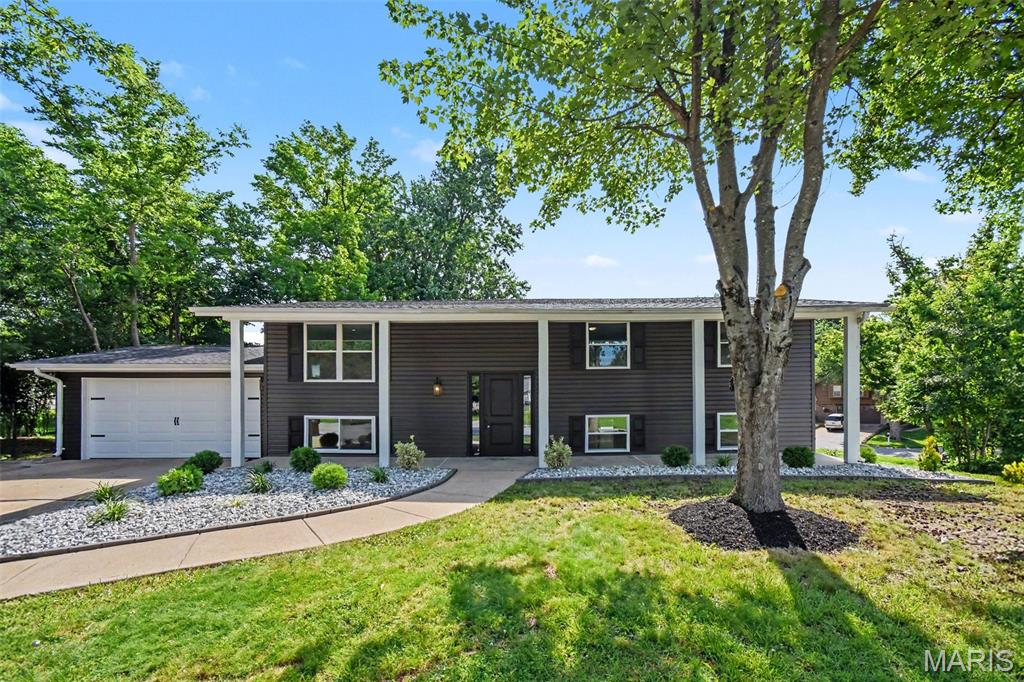 Welcome to this stunning fully renovated home located in a sought-after lake community offering lake access, community pool, clubhouse and tennis courts.  No detail was overlooked in this complete top to bottom renovation.  Enjoy peace of mind with newer 200 amp electrical, plumbing, HVAC system in 2026, water heater, windows, vinyl siding, composite deck, interior and exterior doors and beautiful new flooring throughout. The show stopping kitchen features a large center island, custom soft-close cabinetry, pull-out pantry shelving and exceptional finishes that are sure to impress. Three full Bathrooms have also been beautifully remodeled with today's most desirable design elements.  Every inch of this home has been thoughtfully updated, blending modern style with quality craftmanship. The finished walk out lower level provides incredible flexibility with a spacious rec room plus two additional rooms perfect for bedrooms, guest space, private offices, home gym or hobby rooms.  Every inch of this home has been thoughtfully renovated creating modern comfort, timeless style and outstanding community amenities.  Enjoy lake living at its best with nothing left to do but unpack. OPEN HOUSE SATURDAY, JUNE 27TH 12:00-2:00 AND SUNDAY JUNE 28TH 1:00-4:00!