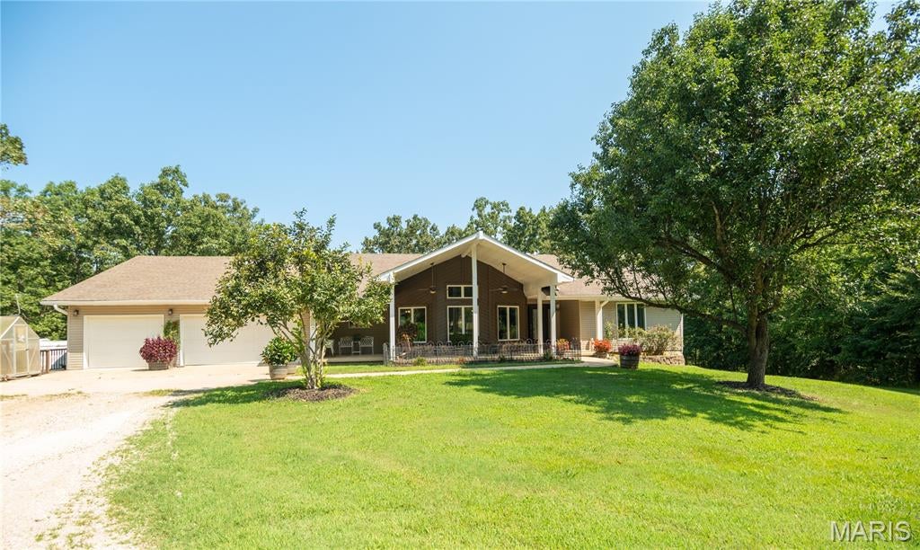 Escape to ultimate privacy and endless possibilities with this exceptional 4-bedroom, 4-bathroom residence situated on 28 rolling acres. Perfect for outdoor enthusiasts, homesteaders, or anyone seeking room to spread out, this property directly borders protected government land, expanding your backyard into hundreds of acres of untouched nature, hunting, and trail riding.
The Home-
Spacious Living: A bright, open-concept floor plan designed for effortless entertaining and comfortable daily living.
4 Dedicated Bedrooms: Generously sized rooms featuring a spacious primary suite complete with a private bath and walk-in closet.
4 Full Bathrooms: Conveniently located throughout the home, ensuring privacy and ease for family and guests.
Large Finished Basement: A massive lower-level flex space perfect for a media room, home gym, game room, or additional guest quarters.
Outdoor Living & Amenities---
Covered Back Deck: An expansive, elevated outdoor living area built for relaxing in the shade, taking in panoramic views, and watching local wildlife.
Detached Shop: A heavy-duty, multi-bay shop ideal for hobbies, woodworking, machinery, or operating a home business.
Covered RV Parking: Dedicated high-clearance shelter to keep your RV, camper, or boat protected from the elements year-round.
28 Private Acres: A beautiful mixture of open pasture and mature timber, offering absolute serenity with direct access to adjoining public land for hiking, hunting, and exploring.

Whether you are looking for a self-sufficient homestead, a premier hunting property, or a tranquil rural retreat with top-tier storage, this unique estate delivers unmatched freedom and functionality.