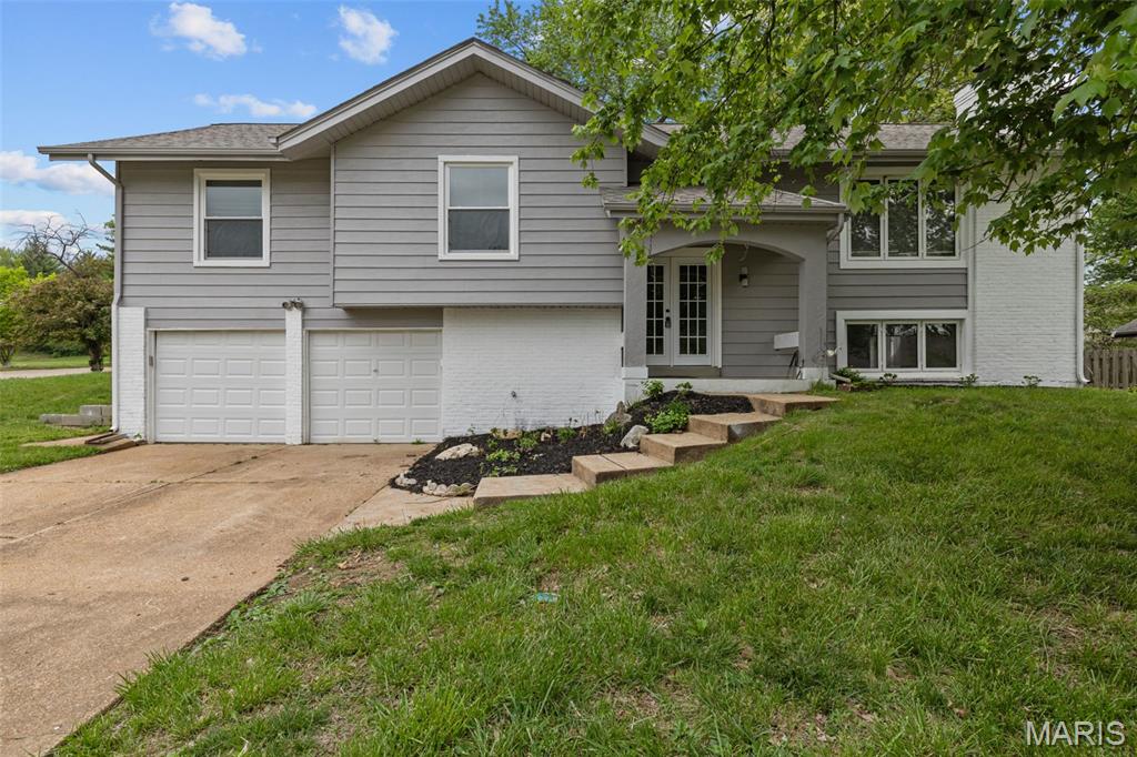Fully renovated 4-bedroom, 3-bathroom home in highly desirable Creve Coeur location. Updated kitchen features stainless steel appliances, custom cabinetry, and quartz countertops that extend throughout all bathrooms for consistent high-end finishes. Open-concept main level with abundant natural light creates spacious feel in living and dining areas. Premium upgrades include designer lighting, quality flooring, and modern hardware throughout. Split-level floor plan offers flexible living spaces ideal for home office, guest quarters, or recreation areas. Two-car attached garage. Move-in ready condition with thoughtful updates in every room. Prime neighborhood location with excellent schools and convenient access to shopping and dining. This quality of renovation in this location will not last long