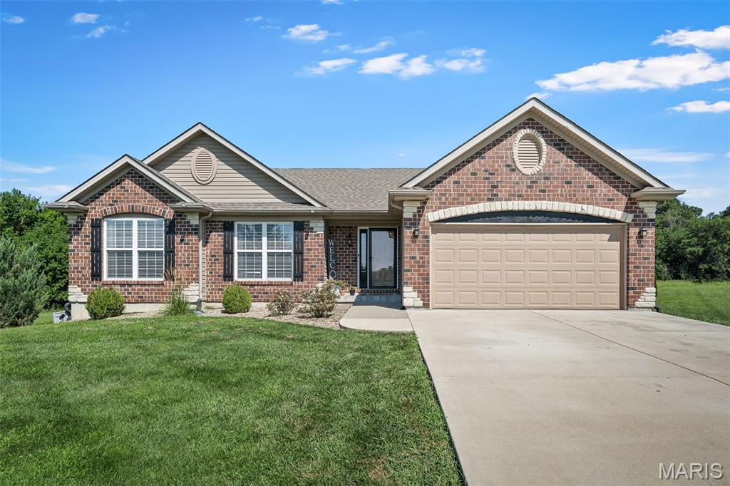 Enjoy the perfect blend of country living and everyday convenience on 2.54 level, partially wooded acres just off Highway 61 in Lincoln County, with easy access to Troy, Bowling Green & Wentzville. 

This beautiful 4-bedroom, 2-bath home features an open, vaulted floor plan with a welcoming foyer that flows into the spacious great room. The kitchen offers a center island/breakfast bar, abundant cabinetry, and walks out to the patio overlooking the above-ground pool and peaceful backyard. A convenient main-floor laundry room adds to the home's functional layout.

The primary suite includes a private bath with double vanities, a garden tub, and separate shower. The lower level features a finished fourth bedroom and a versatile bonus room perfect for a home office, hobby room, or workout space. The remaining basement is unfinished with rough-in plumbing, offering plenty of storage and room to expand.

Outside, you'll appreciate the level acreage, mature trees, and utility shed, providing space to enjoy the outdoors while still being just minutes from shopping, dining, and everyday amenities. This is the perfect opportunity to enjoy the privacy of country living without giving up the convenience of nearby town.
