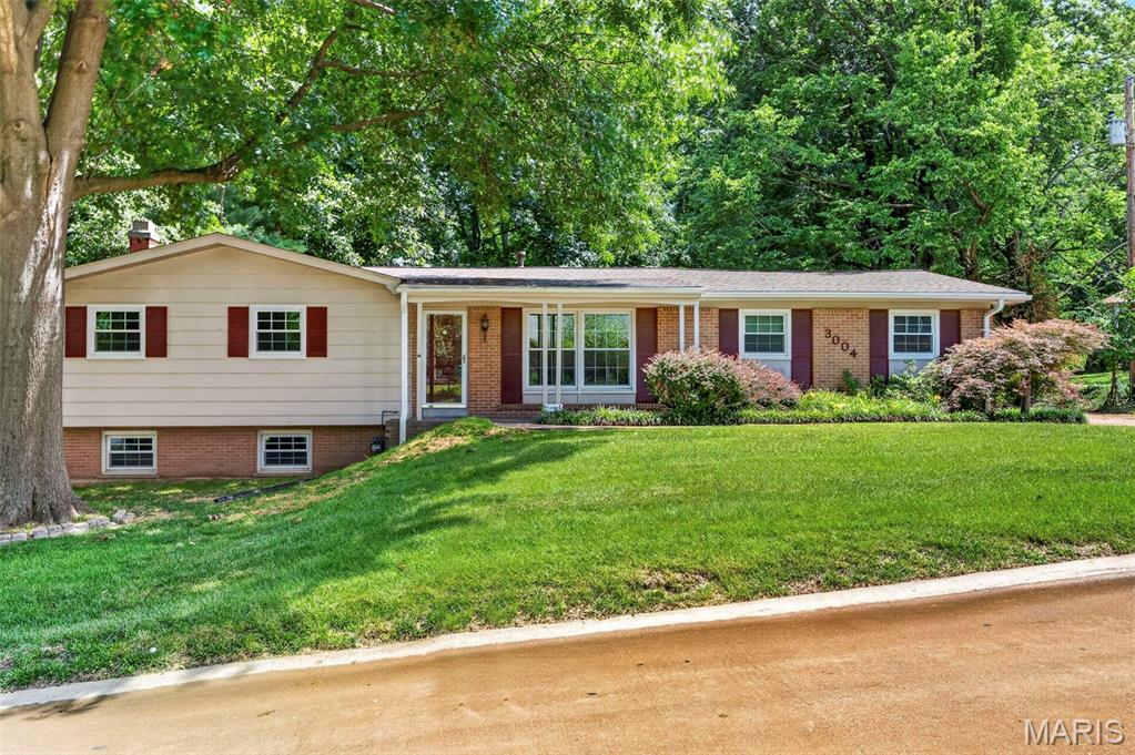 Nestled on just over half an acre and backing to mature trees, this well-maintained 4-bedroom, 3-bath home offers the perfect blend of privacy, space, and convenience. With over 1800 total finished square feet, including a finished lower level, there's plenty of room for everyday living and entertaining. The spacious floor plan features comfortable living areas, generous bedrooms, and a versatile finished basement ideal for a family room, recreation space, home office, or guest suite. Enjoy peaceful views from the newer deck overlooking the tree-lined backyard. The kitchen has been remodel including new stainless steel appliances. The spacious home features newer roof, windows, retaining wall, flooring and updated baths. A side-entry 2-car garage adds curb appeal and functionality. Located in a desirable St. Charles location with easy access to parks, shopping, dining, and major highways. Don't miss the opportunity to make this beautiful property your next home!