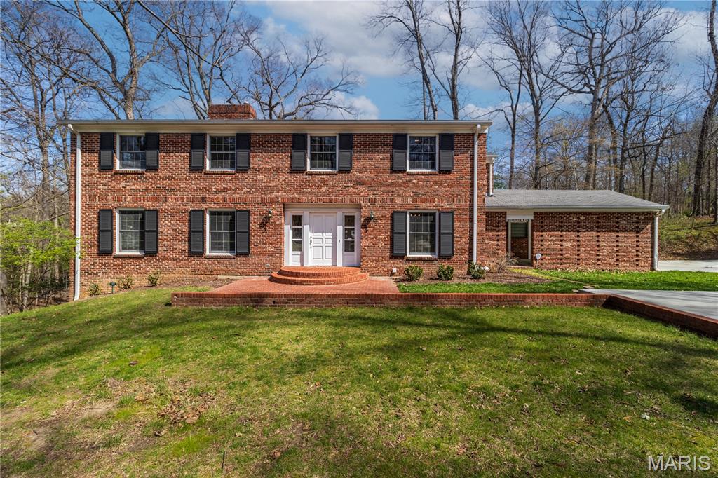 Iconic one owner John Boardman designed home on desirable Brookwood Drive. This expansive two-story home is almost 5,000 square feet, surrounded by mature trees and full of opportunity. Main level offers a formal living room with beautiful natural light & fireplace with marble surround, the family room has a warm and cozy feel with brick fireplace, beamed ceiling & opens to the back patio and kitchen. A formal dining room at the front of the home could also be used as a main level home office. Kitchen has a nice layout overlooking the family room with double oven, window looking to the back yard & mud room/ main level laundry right off it. Upstairs you find FIVE good size bedrooms. Even a jack-n-hill style bathroom that opens to a bedroom and hallway access for the other rooms. Large primary bedroom has its own ensuite bath. Need more room? The basement follows suit with loads of space - family room, game room, recreation space, wet bar, another finished room for office/playroom, full bath & it walks out to the backyard. Sitting on ½ an acre lot with inground sprinklers, a brand new concrete driveway for plenty of parking & walking distance to Scivally Park and Alma Schrader - even a creek at the edge of the property for kids to explore in - memories will surely be made here. With solid bones and classic charm, come bring your vision and style. This home has already raised one family and is now ready to welcome a new family home. A rare chance to own a renowned John Boardman designed home & create something truly special!
