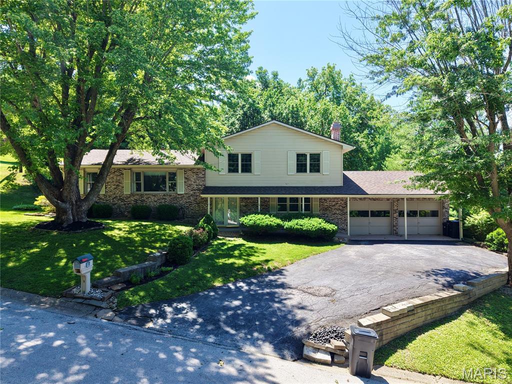 Welcome to this exceptional tri-level home offering the space and flexibility modern families want. With three distinct living and family room areas spread across multiple levels, there's room for everyone to gather, relax, or unwind in their own space.
The heart of the home features a cozy hearth room with gas insert fireplace, perfect for morning coffee alongside a well-appointed eat-in kitchen and dedicated coffee bar and desk area. A designated dining room provides an elegant setting for entertaining, while the sunroom invites you to enjoy natural light year-round.
Upstairs, three generously sized bedrooms and two full bathrooms ensure comfort and privacy for the whole family. The main level den anchors the home with a classic wood-burning fireplace, adding warmth and character. There is an additional bedroom on the main level, full bathroom and laundry room.
The lower level delivers even more living space, complete with a stylish wet bar. Step outside to a private yard with a garden shed, offering space to grow, store, and enjoy the outdoors.
Peace of mind comes standard with a brand new roof and move-in ready.