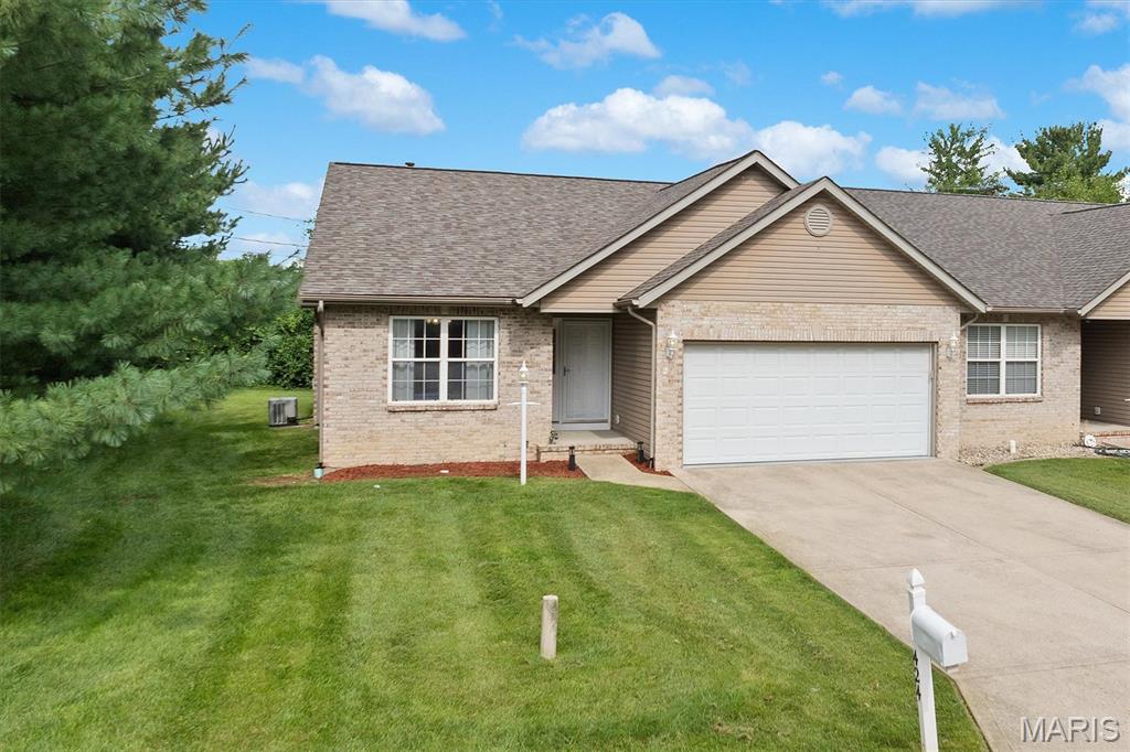 Low-maintenance living meets a desirable layout in a fantastic location! This move-in ready villa offers the perfect combination of comfort, flexibility and convenience in a small community with affordable HOA dues covering roof and siding insurance, lawn care and driveway snow removal- Plus the roof is brand new! The main level features a thoughtfully designed floor plan with an easy, natural flow from room to room. The foyer welcomes you with hardwood flooring and leads to a guest bedroom and full bath, while the spacious living and dining room combination offers a vaulted ceiling and gas fireplace. The open-concept design continues into the eat-in kitchen and breakfast nook, creating a great space for everyday living and entertaining. Hardwood flooring adds warmth to the foyer, kitchen and breakfast nook, while the kitchen offers staggered cabinetry, counter seating and stainless steel appliances. A conveniently located laundry room just off the kitchen provides additional storage and ceramic tile flooring. The spacious primary suite features a vaulted ceiling and private bath with double vanity and tile flooring. Fresh paint throughout the main level gives the home a bright, refreshed feel and makes it truly move-in ready. The lower level is where the possibilities really open up! Already partitioned with space for a large rec or family room, third bedroom, office, hobby room or whatever best suits your needs. A bathroom is already in place, making it easy to create additional finished living space and tailor the lower level to your lifestyle. A 2-car attached garage with an epoxy floor adds convenience, functionality and extra storage space. Enjoy the outdoors from the backyard composite deck—perfect for relaxing, grilling, or entertaining. Great location close to shopping, dining, parks and everyday conveniences, with easy access to everything you need. If you're looking for a villa with a desirable layout, great flow, flexible living space, low-maintenance lifestyle  and a brand-new roof, this one checks all the boxes!!
