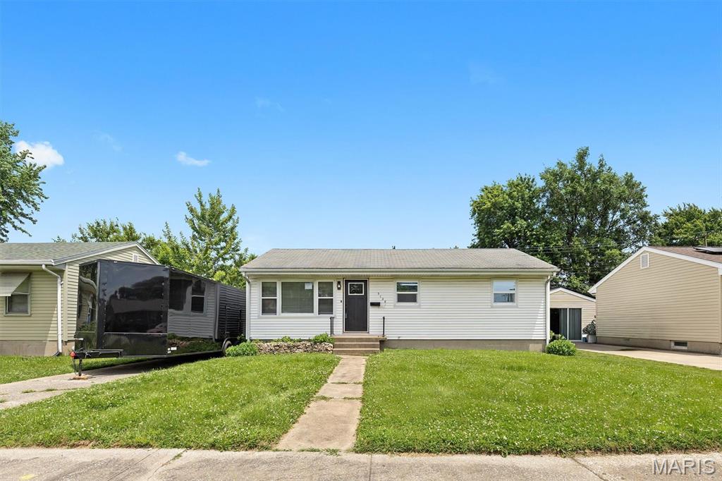 Updated Ranch with full, unfinished basement.  New Appliances, New Windows, Updated bathroom and kitchen with new luxury vinyl plank flooring and modern finishes.  Level lot, partially fenced yard.  Private driveway - off street parking.  Plenty of storage in basement.