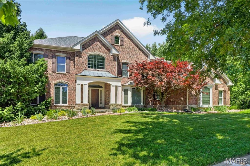 Welcome home to this beautifully updated 2-story residence situated on a nearly one-acre lot in the desirable Greystone subdivision. Featuring wood flooring throughout most of the home and 9-foot ceilings on both the main and upper levels, this home offers exceptional space, quality, and timeless appeal. The impressive 2-story entry foyer with arched openings is flanked by a private office with glass French doors and an elegant formal dining room with a bay window. The spacious great room features a wood-burning fireplace, bay window, walk-behind bar, and access to the aggregate patio, creating the perfect setting for entertaining. The gourmet kitchen is equipped with a center island, granite countertops, 42" cabinetry, stainless steel appliances, built-in Sub-Zero refrigerator, wall oven, built-in microwave, gas cooktop, warming drawer, walk-in pantry, additional pantry storage, and an adjoining breakfast room with planning desk and butler's pantry. The vaulted sunroom, complete with built-in speakers and patio access, provides the ideal space to relax and enjoy views of the expansive backyard. Upstairs, the luxurious primary suite is accessed through double doors and features a coffered ceiling, linen closet, and a large walk-in closet with custom organizers. The beautifully updated primary bath offers double vanities, a freestanding soaking tub, oversized walk-in shower, private water closet, and a bay window with window seat. Three additional bedrooms complete the upper level, including one with a private ensuite bath and two connected by a Jack-and-Jill bath. The finished lower level offers additional living and entertaining space with a large game room, family room, wet bar area, private office or sleeping area, and a full bath. Additional highlights include a 3-car side-entry garage, zoned HVAC systems, and a new roof. Prepare to fall in love with a home that exceeds expectations at every turn!