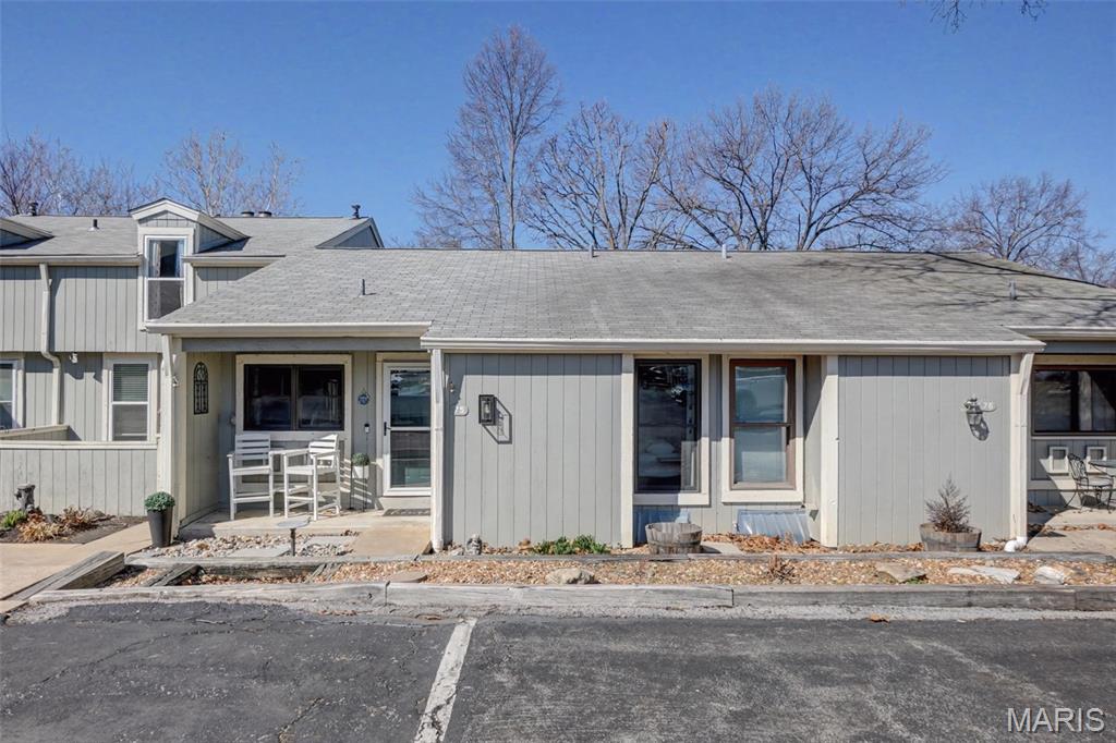 Now is the time to grab this unique, updated single story townhouse   Modern Lakeside Retreat in Harbor Town – With the opportunity to enjoy the lake from your boat.  Harbor Town has a private marina with no wait.  Experience Lake St. Louis living in this beautifully updated single-story townhome. The main level features all the updates expected by todays buyers starting with the kitchen which features new appliances, sleek cabinets, solid surface counters and a mobile island.  Luxury vinyl plank flooring, modern paint, and an oversized living room anchored by a robust stone fireplace complete the living space. Enjoy lake views from the versatile addition, perfect as a 4-season room or a second main-floor bedroom. Notable upgrades include a newer HVAC, AC, Water Heater, and windows as well as a great kitchen.  The full bath on the main level features a soaking tub and new vanity as well as modern light fixtures. The finished lower level offers two rooms which could be cozy sleeping spaces or effective office space or work out rooms , a full bath with a walk-in shower, a workshop, and ample storage. Residents enjoy exclusive Harbor Town amenities: access to a  boat slip in the private marina, a saltwater pool, and a private beach. This turnkey gem won't last! Lake St Louis Community Association membership is required which gives the new owner lake rights. Harbor Town is a Planned Unit Development, not a condo association thus financing options are abundant.