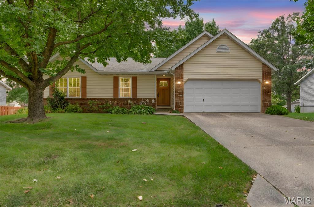 **Charming New Listing — 2313 Holiday Ln, Maryville, IL 62062** 

One-level living meets modern updates in this 3-bedroom, 2-bathroom ranch located within Maryville's popular Copper Creek subdivision. At 1,218 square feet, every inch has been thoughtfully maintained — and improved — to deliver a home that's genuinely ready for its next chapter.

Brand new laminate flooring stretches across most of the main level, giving the interior a clean, cohesive feel the moment you enter through the new front door. The family room anchors daily life with a cozy gas fireplace, while the kitchen serves up generous countertop space, ample cabinetry, and all appliances included. Main floor laundry keeps routines simple, with the washer and dryer conveying at closing.

A private primary suite with its own ensuite bath creates a true retreat, and a second full bathroom — featuring a shower convertible to a tub — adds flexibility for a variety of needs. Downstairs, an unfinished basement plumbed for a future bath opens the door to serious expansion potential whenever inspiration strikes.

Just outside is a beautifully landscaped yard, spacious patio with an arbor perfect for weekend gatherings, and a large backyard offering room to roam. Leaf guards on the gutters and dual hot water heaters round out the practical upgrades.

Drost Park sits just minutes away, alongside medical facilities, dining options, and easy interstate connectivity — placing everyday essentials nearby.