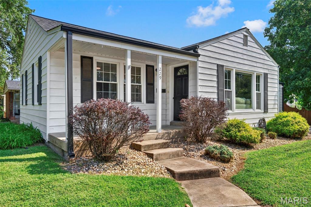 Kirkwood cuteness on a corner lot! This charming 2-bedroom, 1-bath home is packed with updates and perfectly located across from an elementary school. Step inside to fresh paint, updated lighting, a gorgeous stone fireplace, and a bright, open layout. The updated kitchen with new appliances flows seamlessly into the dining area, making everyday living and entertaining easy. New refrigerator and dishwasher added in 2023, with LVP flooring added to the kitchen and breezeway in 2024. Updated bath, too! The exterior was painted in 2023, along with updates to the garage and gutters. A new back door and deck were added in 2022, creating an inviting spot to enjoy the fenced backyard. With a one-car garage and plenty of curb appeal, this home checks all the boxes. And the location? Fantastic walkability to schools, parks, shops, restaurants, and all the things that make Kirkwood so special. Updated, adorable, and ready to love—this one is a must-see!