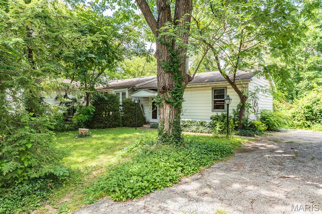 Wonderful opportunity for an investor to either renovate the existing house, or tear down and build new! Located just across Barrett Station Rd from The Transportation Museum, the neighborhood features many new construction homes in the $1-1.5+ million price range, providing great comps to build a dream home! With 0.59 acres of level lot lined with mature trees for privacy and located at the top of the hill, there are several options for the placement of a new house. The existing home has 3 bedrooms, 2 full baths, large great room addition with wood burning fireplace, and a partially finished basement. Property being sold as is.