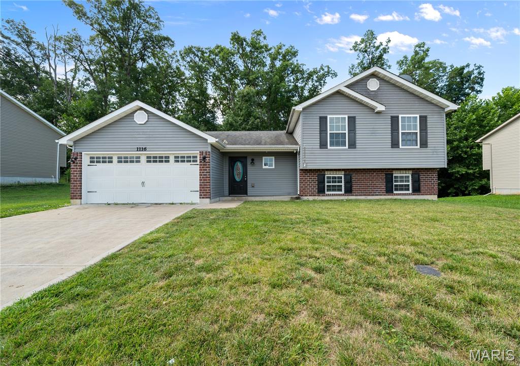 Welcome to this inviting 3-bedroom, 2-bath split-level home offering approximately 1,239 square feet of comfortable living space in desirable St. Charles County with the peaceful charm and country feel often sought after in Lincoln County. This home is ready to move in and is just waiting for your family to call it home! Ideally located near Indian Camp Creek Park, this property offers the perfect blend of convenience, outdoor recreation, and a relaxed country feel. The functional split-level floor plan provides comfortable living spaces with room to fit your lifestyle, whether you're entertaining guests or enjoying a quiet evening at home. The unfinished basement offers excellent potential for future expansion, featuring egress windows for an additional bedroom, giving you the opportunity to create additional living space tailored to your needs. Enjoy the benefits of a country-inspired atmosphere while remaining close to modern conveniences. Don't miss your chance to make this well-located home your own!