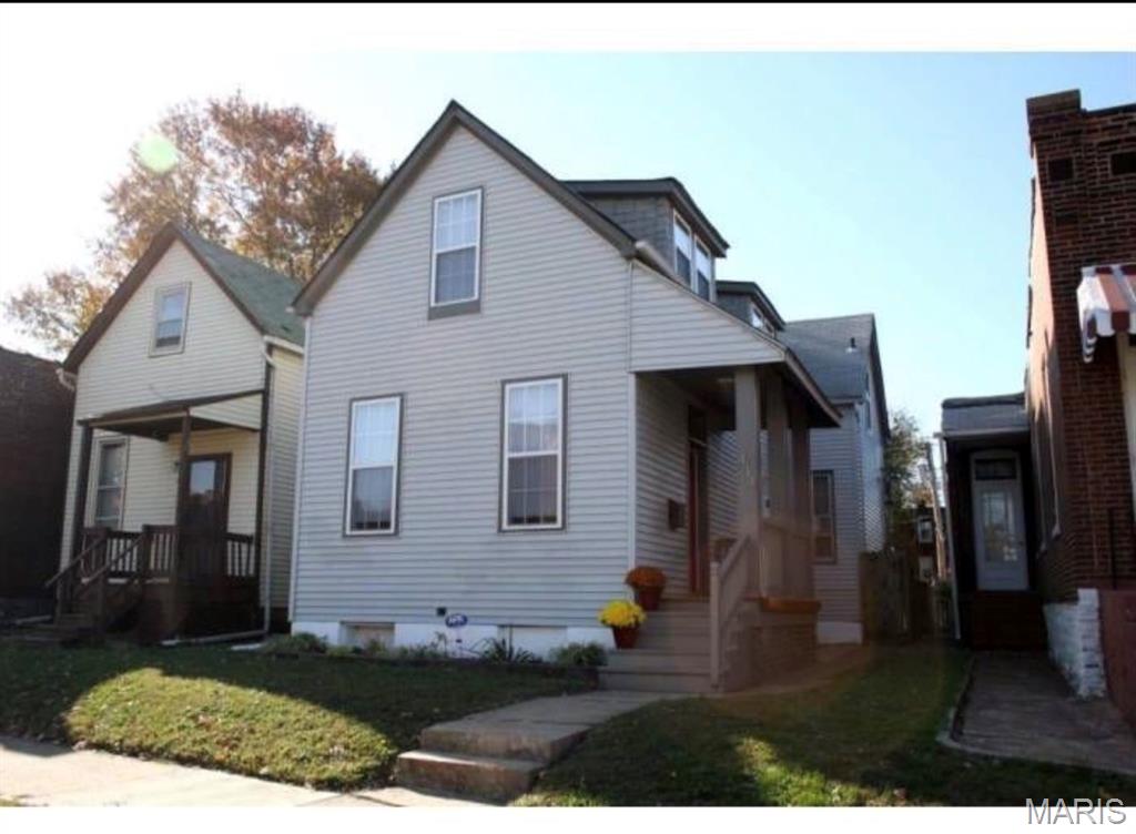 Homeownership is YOURS with this affordable, move-in ready home. Super easy access to I-55 makes your commute downtown incredibly fast. You're also just a short walk from Bellerive Park. Large updated kitchen with impressive custom tilework, natural stone countertops & all appliances included. You'll love the window over the sink--it looks out on the fenced yard with deck & paver stone patio--the ultimate bbq spot! Spacious living room with 10 foot ceilings & chair rail. Formal dining room with mood-enhancing decorative fireplace. Beautifully updated bath on main floor with a shtub. Three good-sized bedrooms upstairs. Convenient main floor laundry. Energy efficient thermal windows & lots of system updates for peace of mind. This home is move-in ready-- being sold as-is