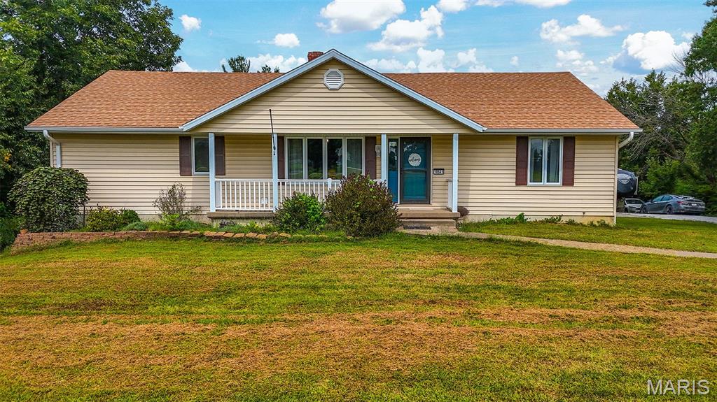RARE FIND ALERT!!  This spacious five bedroom, three bathroom home sits on 5+/- beautiful acres and is packed with features you won't find anywhere else!  The main level boasts a cozy wood fireplace perfect for cooler nights with three main level bedrooms and two baths.  The walk out basement highlights two bedrooms, a full bath with a second kitchen for entertaining guests.  The acreage is perfect for outdoor activities, hobbies, and endless space for your imagination!  Peace of mind is also included, as the seller is generously offering a home warranty.  Do not miss this rare country gem!