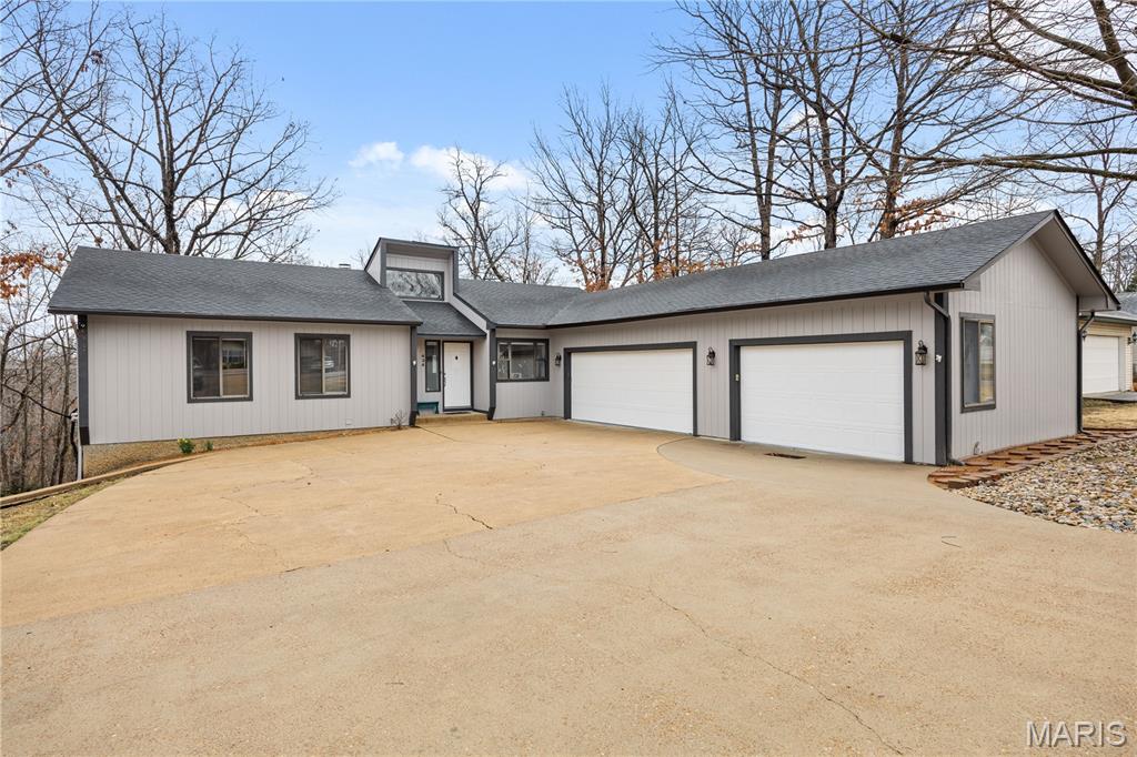 Experience Lake Ozark living in the Village of Four Seasons. Motivated Sellers! This Ranch style walk-out home spans 5+ beds & 3 baths, offering a rare layout designed for large families, multi-generational living, & dual-family ownership. The interior shines with new tile entry, carpet, LED fixtures, ceiling fans, doors. The chef's kitchen boasts quartz countertops, tile backsplash, & new appliances. Primary suite w/ private bath & new quartz vanity. Convenience is key with a dedicated main-level laundry. Versatile Lower Level & ADU Potential as the walk-out lower level serves as true 2nd living quarters, w/ wood-plank laminate flooring, living room w/ gas fireplace, full kitchen, 2 BR, bonus room, & a 2nd laundry. Key features: 3-car heated garage + parking for 9; Safe room (plumbed); 8 total appliances: 2 Refrigerators, 2 Dishwashers, 2 Stoves, 1 Washer, 1 Dryer; Water Softener-Owned; new water heater; 2-year-old roof, gutters, & fresh paint/trim. Close to amenities including, campground, skate park, swimming pool, tennis courts, playground, boat ramps, fishing lakes & even a new aquatic center for year-round swimming, walking path. Don't miss this one-of-a-kind, turn-key gem!