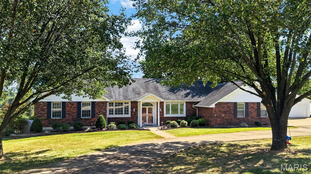 This is the one buyers have been waiting for! Set on 3 beautiful, level acres in Unincorporated St. Charles County and the sought-after Wentzville School District, this exceptional property offers the rare combination of a peaceful country setting, usable acreage, and a wonderfully convenient location. Enjoy the space and freedom you have been searching for—without feeling far removed from everyday amenities.
Inside, the inviting open floor plan is designed for comfortable living and effortless entertaining. The spacious country kitchen features Corian countertops, a gas range, and a generous breakfast room that flows directly into the great room with fireplace. Three bedrooms and two updated full bathrooms are conveniently located on the main level. The finished walkout lower level provides a fourth bedroom, third updated full bathroom, and additional flexible living space.
One of the home’s most appealing features is the expansive covered porch—a fabulous outdoor living area that can be enjoyed throughout the seasons. The walkout basement opens to a large patio and partially fenced yard, ideal for pets and outdoor enjoyment. Beyond the fence, the remaining acreage is level, open, and offers an outstanding setting for a future pool, garden, recreation area, or more.
Garage and workshop enthusiasts will love the oversized 21'x26' attached two-car garage, plus the impressive 24'x24' detached garage with a concrete floor, electricity, drywall, and insulation. It is perfectly suited for additional vehicles, storage, hobbies, a workshop, or a home-based workspace.
Additional features include three full updated bathrooms and a Culligan water-softening and filtration system. With four bedrooms, multiple living areas, exceptional outdoor spaces, two substantial garages, 3 usable acres, highly desirable schools, and a fantastic location, this rare property truly checks all the boxes!

Showings Start at OPEN HOUSE, Thursday, September 10, 2026 from 4-6pm.