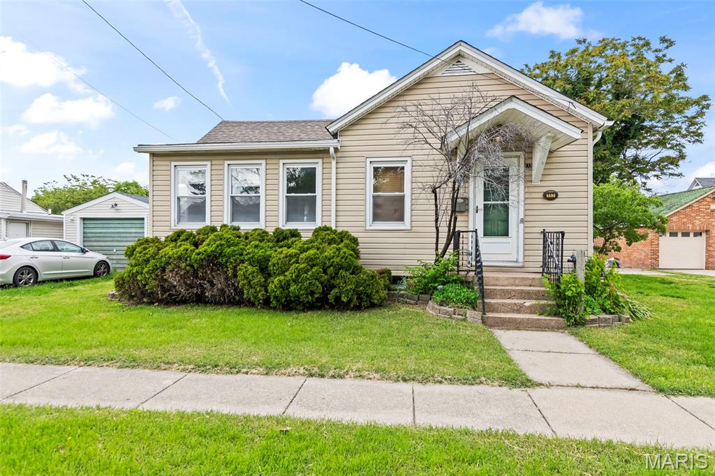 Charming, Cozy & Ready to Welcome You Home! With its adorable curb appeal and inviting feel, this 2 bedroom, 1 bath home is full of charm and comfort! Step inside to find a welcoming living room, dining area, and a cozy kitchen complete with a breakfast nook and convenient main level laundry. The primary bedroom features an attached sitting room that would make the perfect reading nook, home office, or relaxing retreat. Outside, you'll find a 1 car detached garage and a property that’s easy to maintain while still offering all the comforts of home. Whether you're searching for the perfect starter home or looking to downsize, this delightful home is one you won’t want to miss!