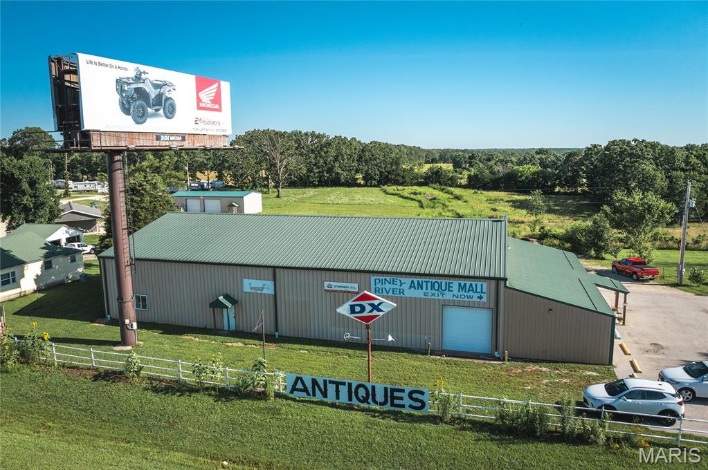 Own a regionally known, income-producing antique mall just off I-44 in Rolla, Missouri. Piney River Antique Mall features approx. 7,200 sq ft of retail space with 87 fully rented vendor booths, a vendor lounge, and multiple loading areas. The second floor adds 1,200 sq ft with vendor space and a private office. Located on 0.68 acres next to a busy RV park, this turnkey business offers excellent visibility, strong cash flow, and long-term vendor relationships. The well-maintained metal building includes HVAC, bright interiors, and thoughtful layout. Pride of ownership is clear in every detail. The name, website, and vendor relationships are negotiable with the sale. Whether you’re an investor or an antique lover looking for your next chapter, this property offers both business potential and small-town charm. Just 25 minutes to Fort Leonard Wood and 1.5 hours to St. Louis or Springfield.