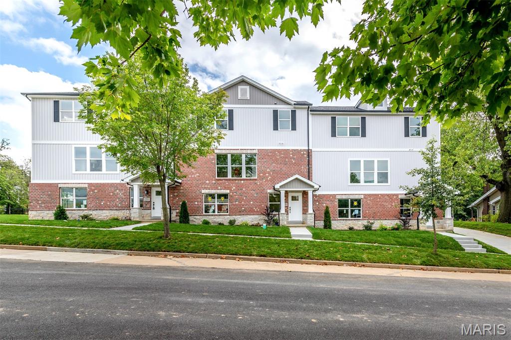 Exceptional investment opportunity in the highly sought-after Clayton School District. This beautifully maintained, two-year-old luxury townhome is part of a well-appointed three-unit building constructed by MK Custom Homes, offering modern design, quality craftsmanship, & low-maintenance ownership.  The open-concept layout features a stylish kitchen with quartz countertops, custom 42” cabinetry, stainless steel appliances, & a spacious center island that flows seamlessly into the main living area—ideal for long-term tenant appeal. A cozy fireplace anchors the living space, while upgraded lighting, fixtures, white paneled doors, & crown molding add lasting value & visual appeal. Upstairs, the property offers a generous primary suite & two additional bedrooms, complemented by adult-height vanities and thoughtfully selected finishes throughout. Additional highlights include 9-foot ceilings, recessed lighting, high-efficiency HVAC, main-level laundry, a two-car garage, architectural shingles, & an attractive stone exterior. This residence benefits from added privacy & abundant natural light. The property is currently tenant occupied, providing immediate income potential. Conveniently located near major highways, downtown Clayton, Forest Park, WashU, Demun, St. Mary’s Hospital, & public transportation, this is a prime location for sustained rental demand.  A rare opportunity to acquire a nearly new, income-producing property in a premier location!