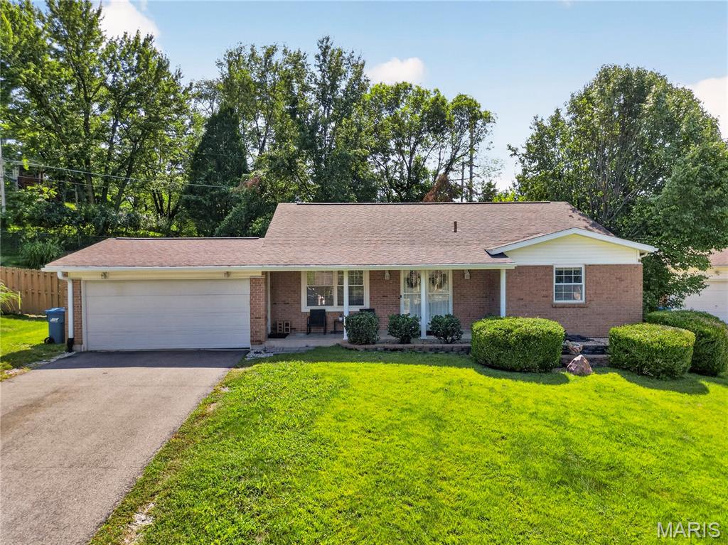 Welcome home to this beautifully maintained brick ranch, perfectly situated on a quiet cul-de-sac with wide streets and a neighborhood park just moments away. Featuring exceptional curb appeal, a level fenced backyard, and an attached two-car garage, this home offers you comfort and privacy. Step inside to a bright, welcoming foyer that opens to an open-concept layout. Hardwood flooring, custom woodwork, and abundant natural light create a warm and inviting atmosphere throughout the main level. The spacious living room flows seamlessly into the dining area and a cheerful kitchen with new floor. Just beyond the open staircase, the sun-filled family room offers an additional gathering space for relaxing with family and friends. The main level includes a generously sized primary suite with a private ensuite bath, along with two additional bedrooms. One bedroom is currently used as a custom walk-in closet and can easily be converted back to a traditional bedroom. Both full bathrooms on the main floor feature elegant ceramic tile finishes. The finished lower level expands the living space, boasting a large recreation room, two additional bedrooms, a luxurious full bath with a jetted tub, and plentiful storage throughout. Outside, enjoy the private, fenced backyard, perfect for outdoor entertaining, gardening, or simply unwinding in a peaceful setting.