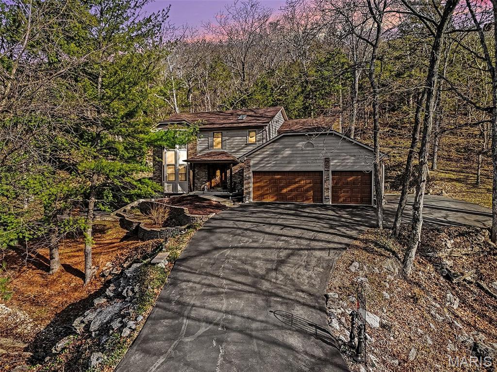 One of a kind, two-story custom-built home on 2 serene acres, this spacious residence welcomes you with a traditional floorplan that’s perfect for everyday living and grand entertaining. It features three generous bedrooms, including a luxurious primary suite, and two full bathrooms upstairs—a convenient half bath on the main level a dining room and 2 living rooms, a spacious kitchen opening to one of the living rooms, perfect for entertaining. A walk out basement with a dedicated basement storage room adds practical convenience, while the overall design emphasizes opulent scale and refined craftsmanship. Located in a highly sought-after neighborhood with ample wildlife, this property blends expansive living areas with superb outdoor potential. Homes in this prestigious area don’t stay on the market long—schedule your tour ASAP!