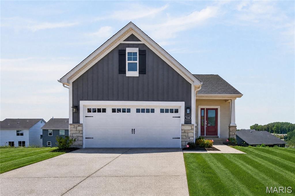 Move In Ready!  Low maintenance, luxury villa living by Fischer and Frichtel in the impressive Harvest neighborhood! Be the first owner of this impressive villa with 3 bedrooms, 3 bathrooms and 2,454 square feet of open living space. The exterior is eye-catching with stone, vinyl siding, board and batten accent siding at the garage gable, carriage style garage door, architectural shingles, landscaping, full yard sod and lawn irrigation.  Features include 9 foot ceilings, luxury vinyl plank flooring, wrought iron stair spindles, 42 inch full overlay cabinets with crown, soft close feature, roll out shelving, island with seating bar, quartz countertops, tile backsplash, stainless steel appliances, gas cooktop, built in oven and microwave, butlers pantry, main floor laundry, raised height bath vanities, walk in closet in the Primary Suite, Spa bathroom in the Primary bath with marble shower and bench seat, comfort height dual vanities, ceramic tile flooring in the Primary Bathroom, Low E windows and more. The finished, walkout lower level has a Family/Rec Room, Flex/Office area, Bedroom and bathroom.  There is a patio at the walkout and a 14x12, covered composite deck off the Great Room for outdoor enjoyment.  The garage has added depth and includes a garage door opener. Fantastic amenities include 47 AC of common ground, a town square, lakes, dog park, food truck court, farmers market, orchards, pumpkin patch, community garden, pickle/bocce ball courts, playgrounds, nature play area with water feature and more.  Students will attend desirable Wentzville schools.